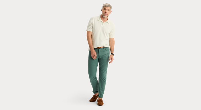View of model wearing Duck Green Jean Cut Pants, Straight Fit.