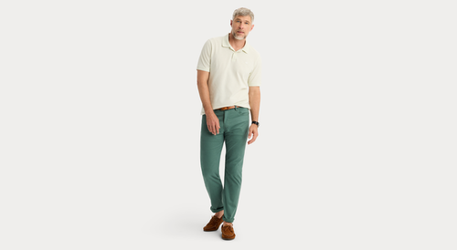 View of model wearing Duck Green Jean Cut Pants, Straight Fit.