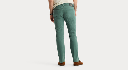 View of model wearing Duck Green Jean Cut Pants, Straight Fit.