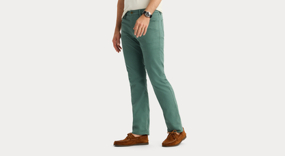 View of model wearing Duck Green Jean Cut Pants, Straight Fit.