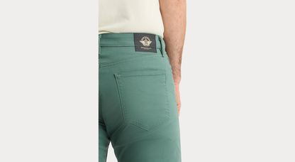 View of model wearing Duck Green Jean Cut Pants, Straight Fit.