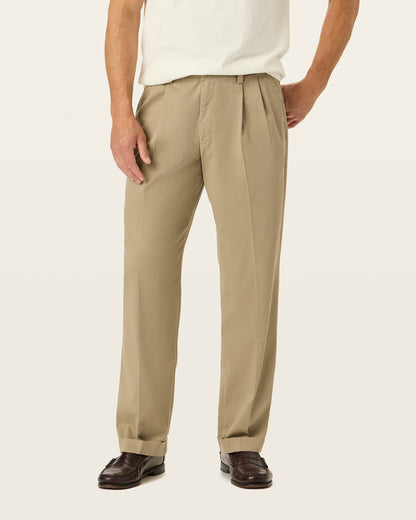 View of model wearing Khaki Easy Khakis, Pleated, Relaxed Fit.