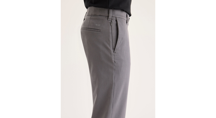 Side view of model wearing Car Park Grey Go Activeflex Chino, Slim Fit.
