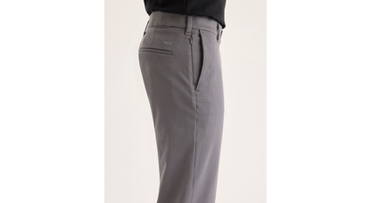 Side view of model wearing Car Park Grey Go Activeflex Chino, Slim Fit.