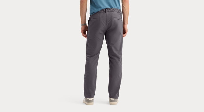 Back view of model wearing Boulevard Go Pro Pant with AceFlex, Slim Fit.