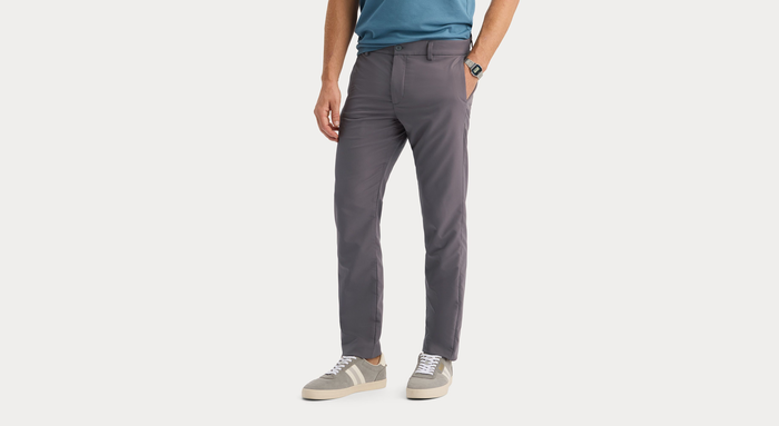 Side view of model wearing Boulevard Go Pro Pant with AceFlex, Slim Fit.
