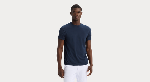 Front view of model wearing Navy Blazer Go Tee, Slim Fit.