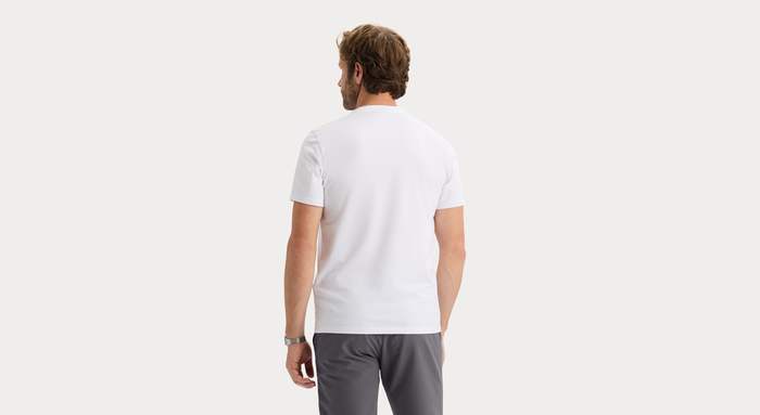 Back view of model wearing Lucent White Go Tee, Slim Fit.