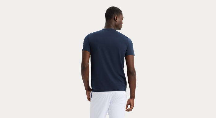 Back view of model wearing Navy Blazer Go Tee, Slim Fit.