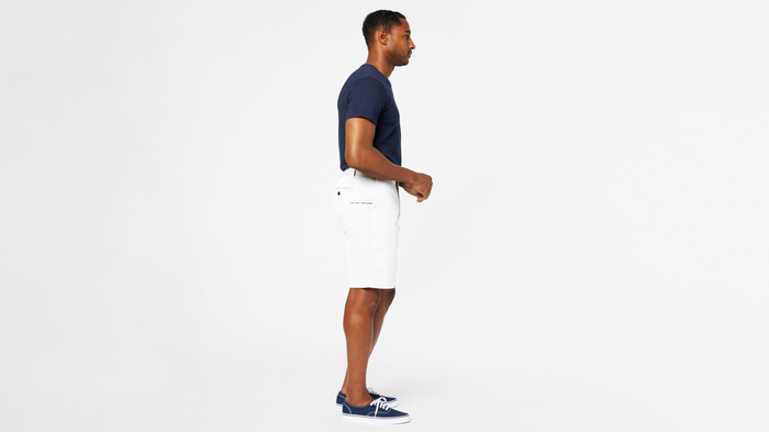 Side view of model wearing White Cap Perfect 10.5" Shorts.