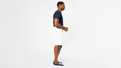 Side view of model wearing White Cap Perfect 10.5" Shorts.