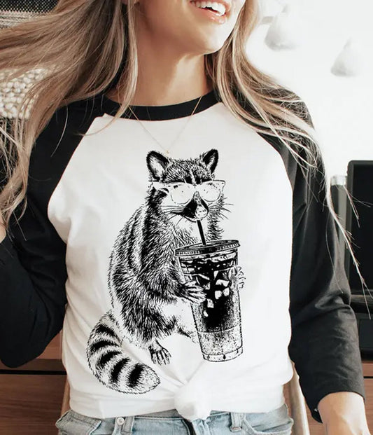 Raccoon Drinking Iced Coffee Raglan Graphic Tee