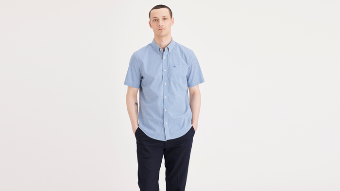 Front view of model wearing Deflt Signature Stain Defender Shirt, Classic Fit.