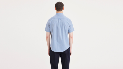 Back view of model wearing Deflt Signature Stain Defender Shirt, Classic Fit.