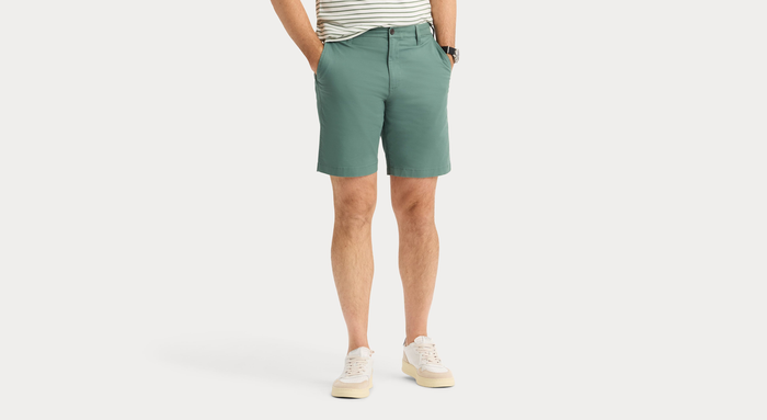 Front view of model wearing Duck Green Ultimate 9.5" Shorts, Straight Fit.