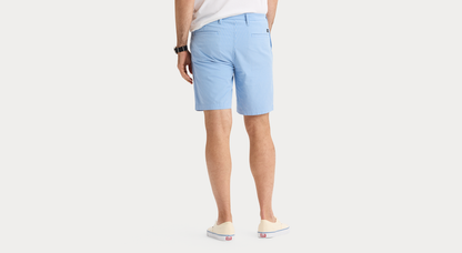 View of model wearing Vista Blue Ultimate 9.5" Shorts, Straight Fit.