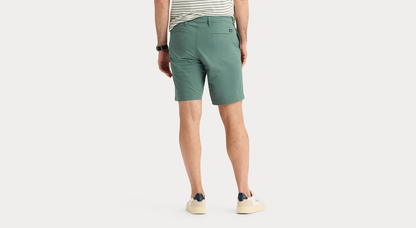 Back view of model wearing Duck Green Ultimate 9.5" Shorts, Straight Fit.