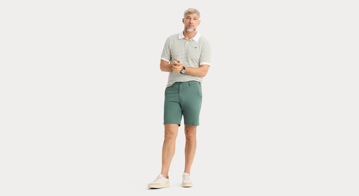 View of model wearing Duck Green Ultimate 9.5" Shorts, Straight Fit.